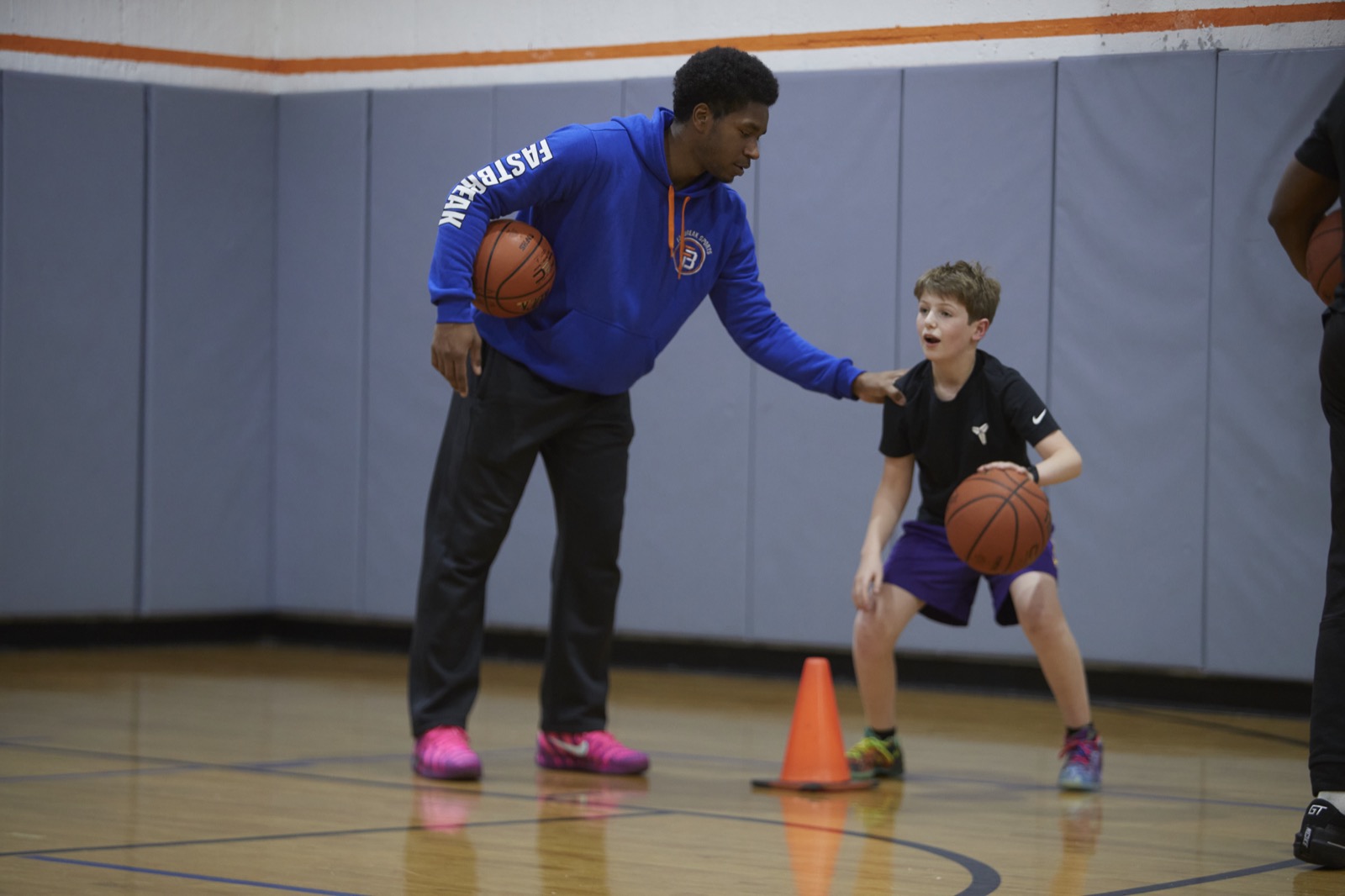 A coach leading a private basketball training session